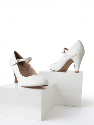 White honey-colored heels by J.Adams with sleek design and pointed toe, made for elegant style and comfortable wear.