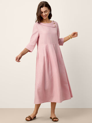LINTICO linen maxi dress with crescent neckline, decorative buttons, and waist pleats, perfect for elegant summer wear.