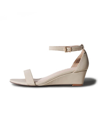 Beige Rosie wedges by J.Adams featuring a stylish open-toe design and wedge heel, perfect for casual or dressy occasions.