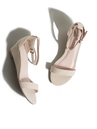 Beige Rosie wedges by J.Adams featuring a comfortable design with ankle straps and a chunky heel.