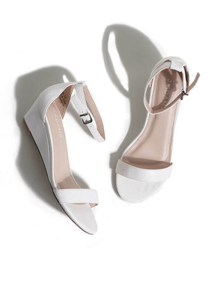 White Rosie wedges by J.Adams featuring a stylish design with a comfortable sole and ankle straps.