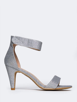 Silver glitter heels by J. Adams featuring a sleek design with shimmering finish, perfect for stylish occasions.