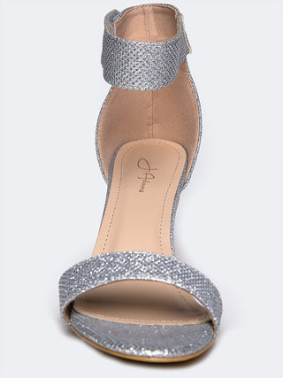 Silver glitter heels by J.Adams featuring a sleek design and stylish stiletto heel, perfect for elegant occasions.