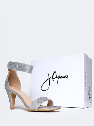 Silver glitter heels from J.Adams with a sleek design, featuring a shiny metallic finish and stylish high heel silhouette.